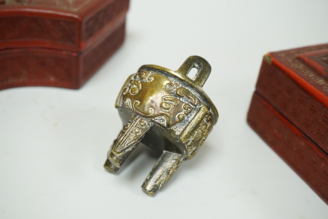 Two Chinese cinnabar lacquer boxes and a Chinese archaistic miniature bronze tripod censer, rectangular lacquer box 11.5cm high x 7.5cm deep